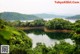 A large body of water surrounded by trees.