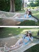 A woman laying in a hammock wearing a hat.